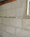 Severely buckling foundation walls in a home in Highland in need of repairs.