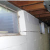 A foundation showing severe inward buckling along the windows in a Huntington home.