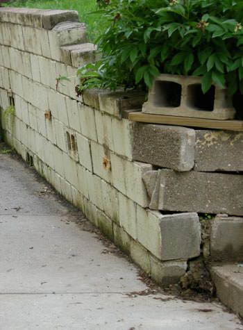 collapsing retaining wall with severe damage in Chesterton