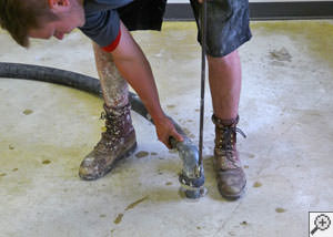 Mudjacking a damaged foundation floor in a Goshen home.