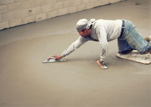 smoothing out the grout in a slab releveling project in Goshen