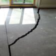 a huge crack in a concrete slab floor in Gary