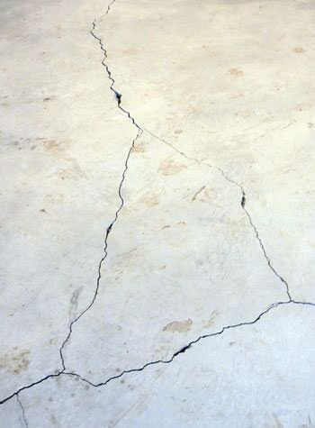 severely cracked, heaving slab floors in a home in Schererville