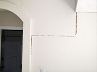 Drywall cracking due to foundation settlement in Highland