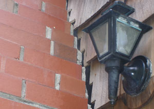 A tilting chimney in Granger showing serious foundation damage.