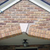 Major tuckpointing on a home archway over a door, with tuckpointing several inches wide that has failed on a Fort Wayne home