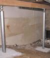 A system of crawl space support posts adding structural support to a crawl space in Auburn