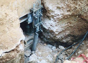 a bent, failed foundation push pier installed in Gary.