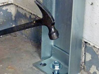 Mounting a foundation channel anchor installation to the floor in Goshen.