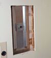 Wall anchor plates installed during a foundation repair in South Bend in a finished basement
