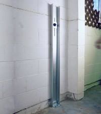 A failing foundation wall repaired with a foundation wall channel anchor system in a Valparaiso home.