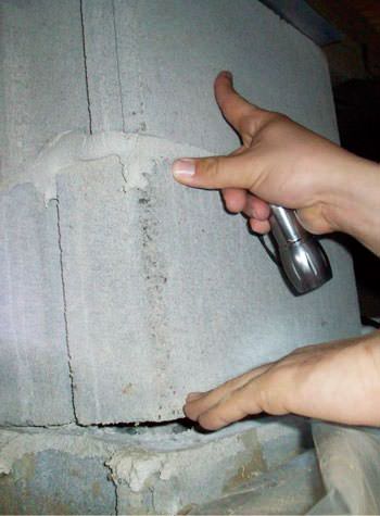 a completely failing concrete crawl space support pillar in Auburn
