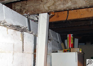 A failing foundation wall and i-beam support in a Fort Wayne home