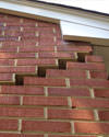 Serious damage to a foundation wall due to settlement of a home in Plymouth